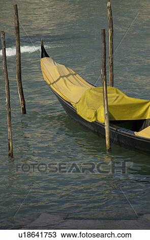 Covered gondola in a canal in Venice, Italy View Large Photo Image Stock Image - Covered gondola in a canal in Venice, Italy. Fotosearch