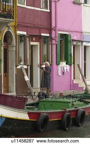 Houses along a canal in Venice, Burano, Italy View Large Photo Image Stock Photo - Houses along a canal in Venice, Burano, Italy. Fotosearch