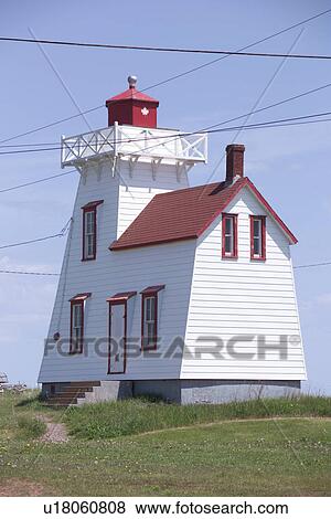 Stock Photo - Light house on the coast in Prince Edward Island, Canada. Fotosearch