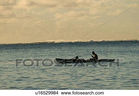 Silhouette of a man rowing a boat in the sea, Moorea, Tahiti, French Polynesia, South Pacific View Large Photo Image Picture - Silhouette of a man rowing a boat in the sea, Moorea, Tahiti, French Polynesia, South Pacific. Fotosearch