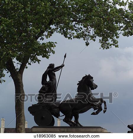 Silhouette of a statue of a man holding a spear and a horse, London, England View Large Photo Image Stock Photography - Silhouette of a statue of a man holding a spear and a horse, London, England. Fotosearch