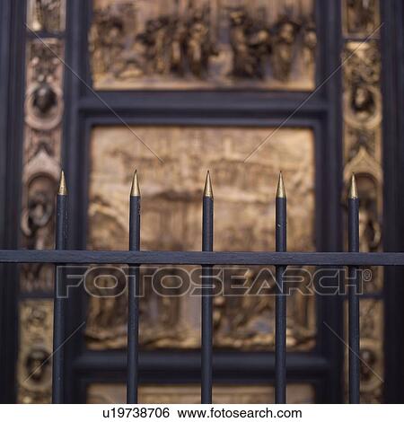 Spikes on fencing protecting carved church door in San Francisco View Large Photo Image Stock Photograph - Spikes on fencing protecting carved church door in San Francisco. Fotosearch