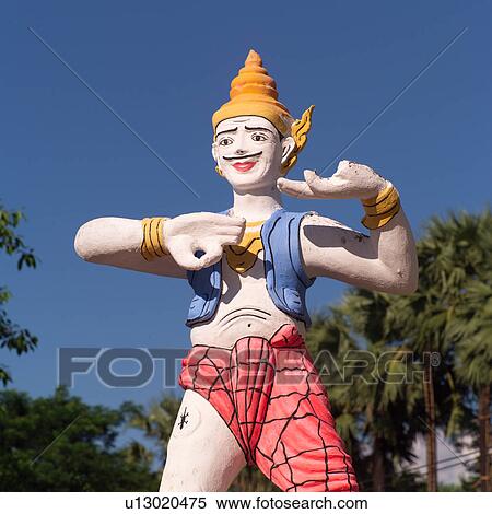 Stock Photography - Statue at entrance to Shwethalyaugn Reclining Buddha Pagoda. Fotosearch