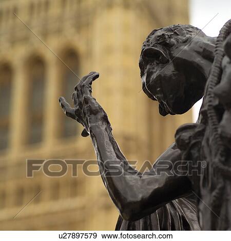 Stone statue of a man outside the house of parliament in London, England View Large Photo Image Stock Photo - Stone statue of a man outside the house of parliament in London, England. Fotosearch