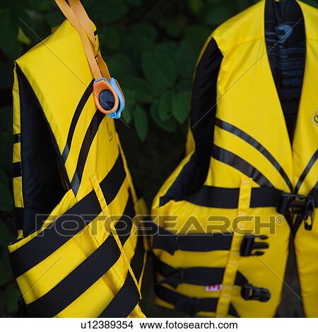 Picture - Two lifejackets suspended. Fotosearch