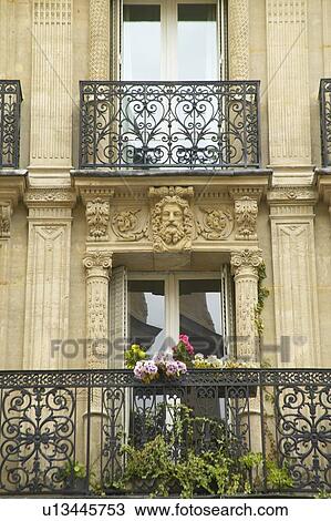 Balcony with carved statuary of apartment View Large Photo Image Stock Image - Balcony with carved statuary of apartment. Fotosearch