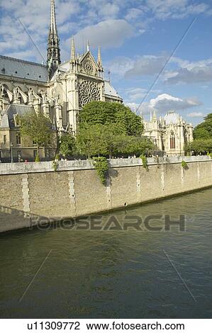 Stock Image - Notre Dame Cathedral next to the Seine River, Paris, France. Fotosearch