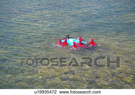 Stock Image - Scuba divers in the Mediteranean on French Riviera, France. Fotosearch