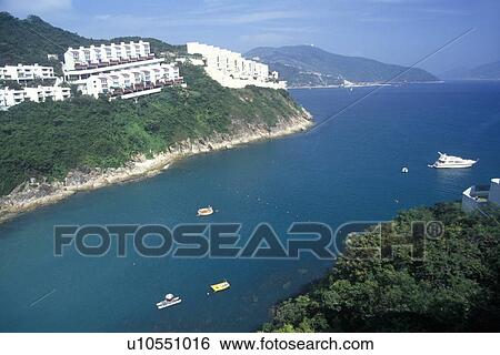 Stock Photograph - Apartments and homes along the shore. Fotosearch