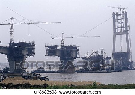 Stock Photo - Construction of suspension bridge in Wuhan. Fotosearch