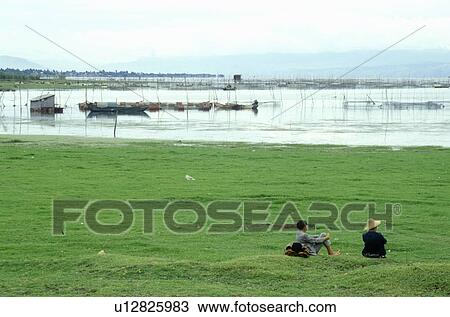 Fishermen on Erhai Lake in Dali, Yunnan Province, People's Republic of China View Large Photo Image Stock Image - Fishermen on Erhai Lake in Dali, Yunnan Province, People's Republic of China. Fotosearch