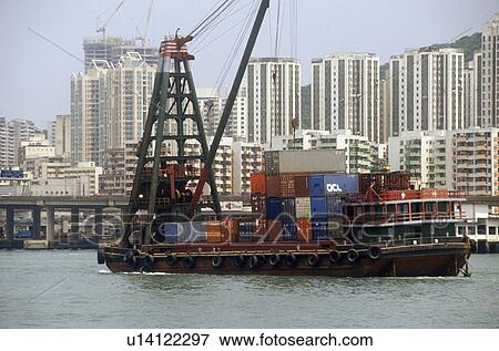 Freighter ships and Hong Kong cityscape View Large Photo Image Stock Photo - Freighter ships and Hong Kong cityscape. Fotosearch