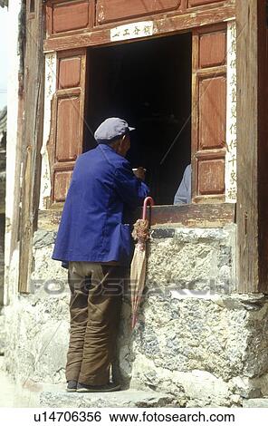 Stock Photograph - Man buying from store window . Fotosearch
