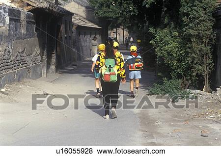 Stock Photo - Schoolboys on way to school . Fotosearch