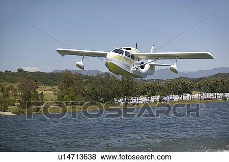 Amphibious seaplane taking off View Large Photo Image Stock Photo - Amphibious seaplane taking off. Fotosearch