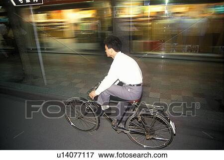 Bicycle riders in Shanghai View Large Photo Image Stock Photo - Bicycle riders in Shanghai. Fotosearch