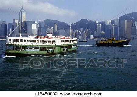 Ferry in Hong Kong Harbor with skyline in background View Large Photo Image Stock Image - Ferry in Hong Kong Harbor with skyline in background. Fotosearch