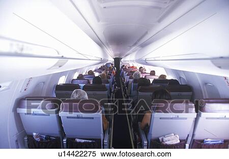 Passengers from the rear of the airplane View Large Photo Image Stock Photography - Passengers from the rear of the airplane. Fotosearch