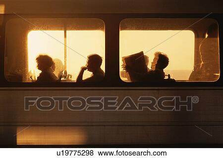 Stock Photo - Silhouetted Metrorail Commuters at sunrise. Fotosearch