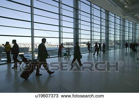 Silhouettes of travelers and airline industry personnel walking in International Airport, New Jersey View Large Photo Image Stock Image - Silhouettes of travelers and airline industry personnel walking in International Airport, New Jersey. Fotosearch