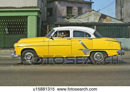 Yellow car drriving View Large Photo Image Stock Photography - Yellow car drriving. Fotosearch