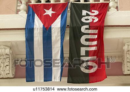 Picture - 26 July flag and Cuban flag, Havana. Fotosearch