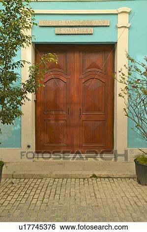 Stock Photograph - A doorway with turquoise walls in Old Havana. Fotosearch