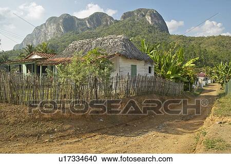 Small houses in front of limestone mountains in central Cuba View Large Photo Image Stock Image - Small houses in front of limestone mountains in central Cuba. Fotosearch