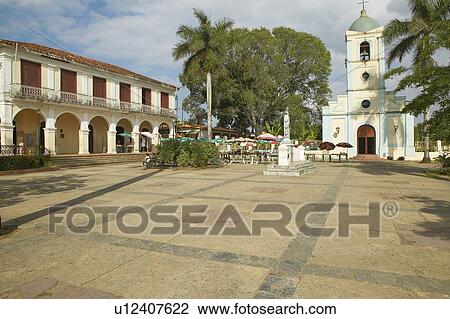 Stock Image - Small village in central Cuba with Catholic Church. Fotosearch
