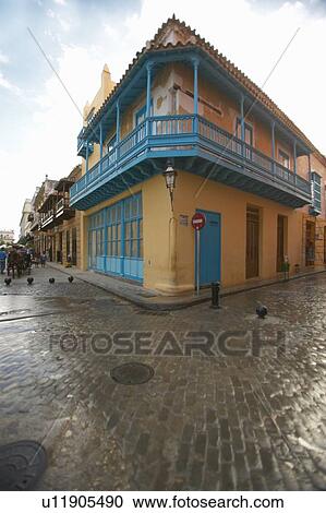 Turquoise shutters on a historic landmark building and cobblestone street in Old Havana View Large Photo Image Stock Image - Turquoise shutters on a historic landmark building and cobblestone street in Old Havana. Fotosearch