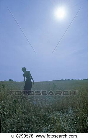 A dancer posing outdoors in front of the sun View Large Photo Image Stock Photo - A dancer posing outdoors in front of the sun. Fotosearch