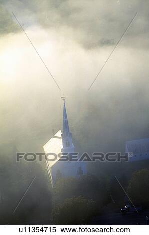 Aerial view of church steeple wreathed in morning fog in autumn View Large Photo Image Stock Photography - Aerial view of church steeple wreathed in morning fog in autumn. Fotosearch
