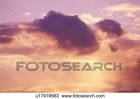 Stock Image - Clouds at Sunset. Fotosearch