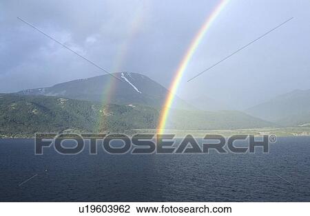 Double rainbow over ocean at Ushuaia, Tierra del Fuego National Park and Andes Mountains, Argentina View Large Photo Image Stock Image - Double rainbow over ocean at Ushuaia, Tierra del Fuego National Park and Andes Mountains, Argentina. Fotosearch