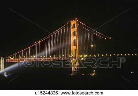 Dramatic lighting on the Golden Gate Bridge for it's 50th Anniversary, San Francisco, California View Large Photo Image Stock Photograph - Dramatic lighting on the Golden Gate Bridge for it's 50th Anniversary, San Francisco, California. Fotosearch