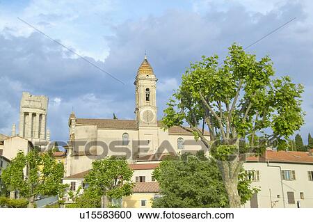 Stock Image - Town of La Turbie with Trophee des Alpes and church, France. Fotosearch