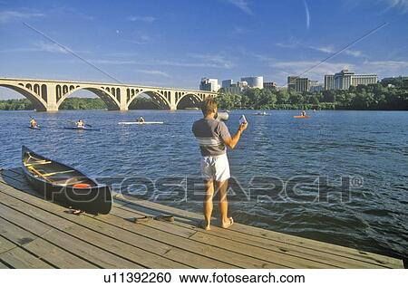 Stock Image - Canoe on edge of Potomac. Fotosearch