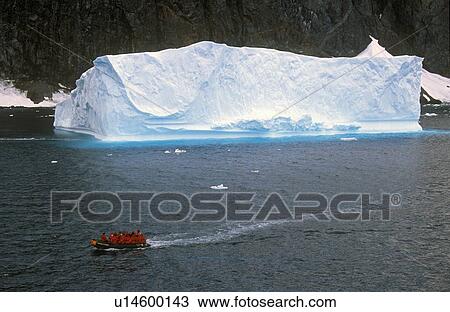 Ecological tourists in inflatable boat in Errera Channel View Large Photo Image Stock Image - Ecological tourists in inflatable boat in Errera Channel. Fotosearch