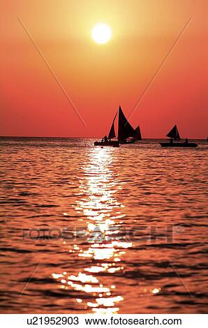Stock Image - Beach at the sunset in Boracay island. Fotosearch