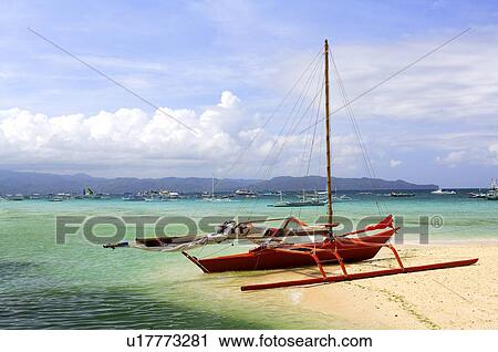 Stock Image - Sailboat on the bench of Boracay island. Fotosearch