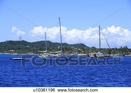 Stock Photograph - Sailboats in the sea. Fotosearch