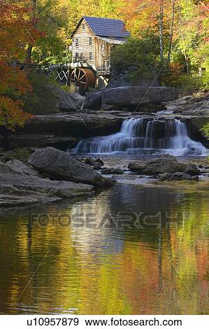 Stock Photo - Grist Mil and autumn reflections and water fall. Fotosearch