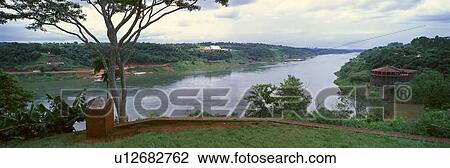Panoramic view of confluence of Iguazu and Parava Rivers at borders of Chile, Brazil and Argentina View Large Photo Image Stock Image - Panoramic view of confluence of Iguazu and Parava Rivers at borders of Chile, Brazil and Argentina. Fotosearch