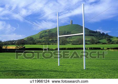 Glastonbury Tor, A sacred site along the English countryside, England and goal posts in green field View Large Photo Image Picture - Glastonbury Tor, A sacred site along the English countryside, England and goal posts in green field. Fotosearch