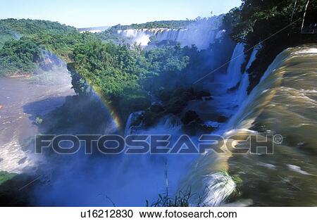 Rainbow over Iguazu Waterfalls in Parque Nacional Iguazu View Large Photo Image Stock Image - Rainbow over Iguazu Waterfalls in Parque Nacional Iguazu. Fotosearch