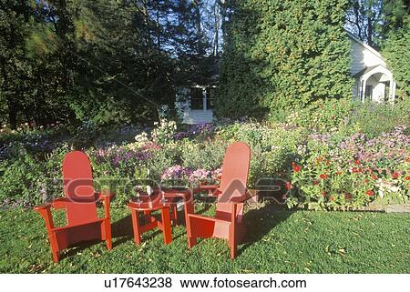 Red deck chairs in garden View Large Photo Image Stock Photo - Red deck chairs in garden. Fotosearch