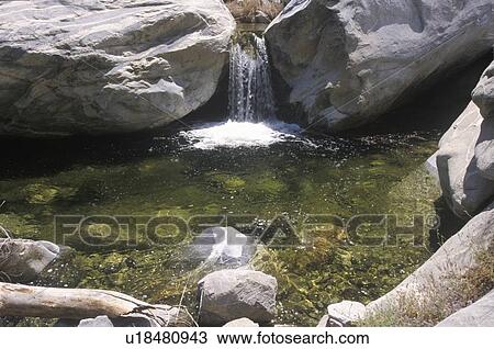 Stock Image - Tahquitz Canyon and waterfall in Palm Springs. Fotosearch