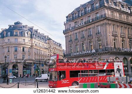 Stock Image - view, cars, city, sitting, pedestrians, street. Fotosearch