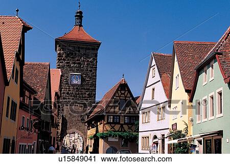 Stock Image - wall, blue sky, clock, roof top, arc, arch. Fotosearch