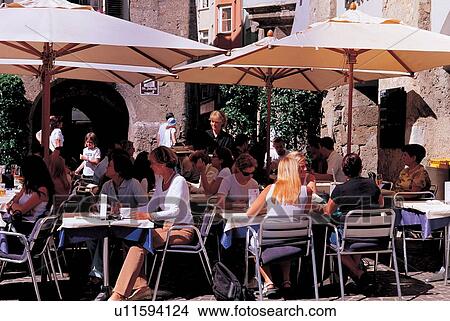 Picture - enjoying, establishment, cafe, hotel, outdoor, shed, tourists. Fotosearch